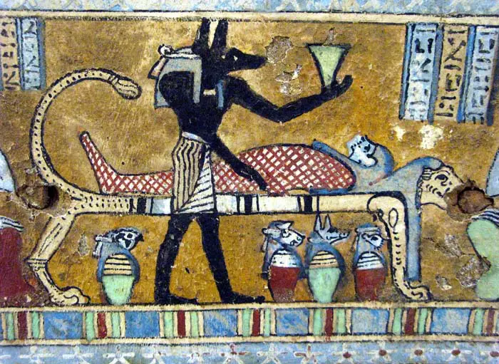 Anubis depicted during the mummification process