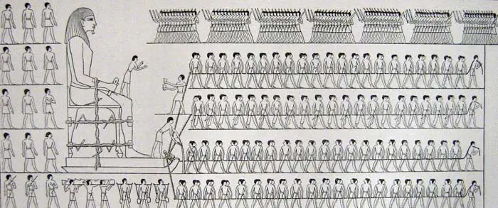 Depiction of workers moving a colossus